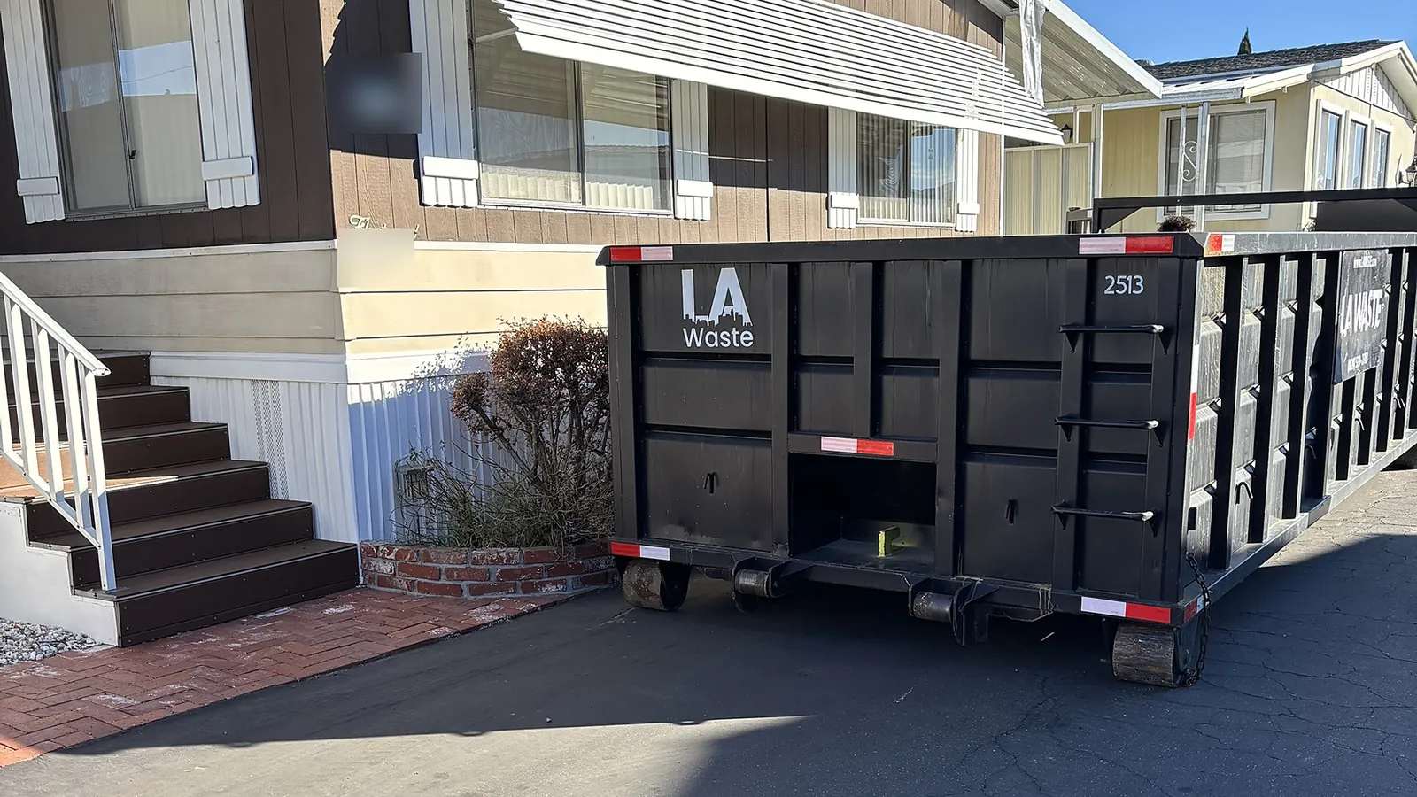 LA Waste 25 yard dumpster at a roofing job