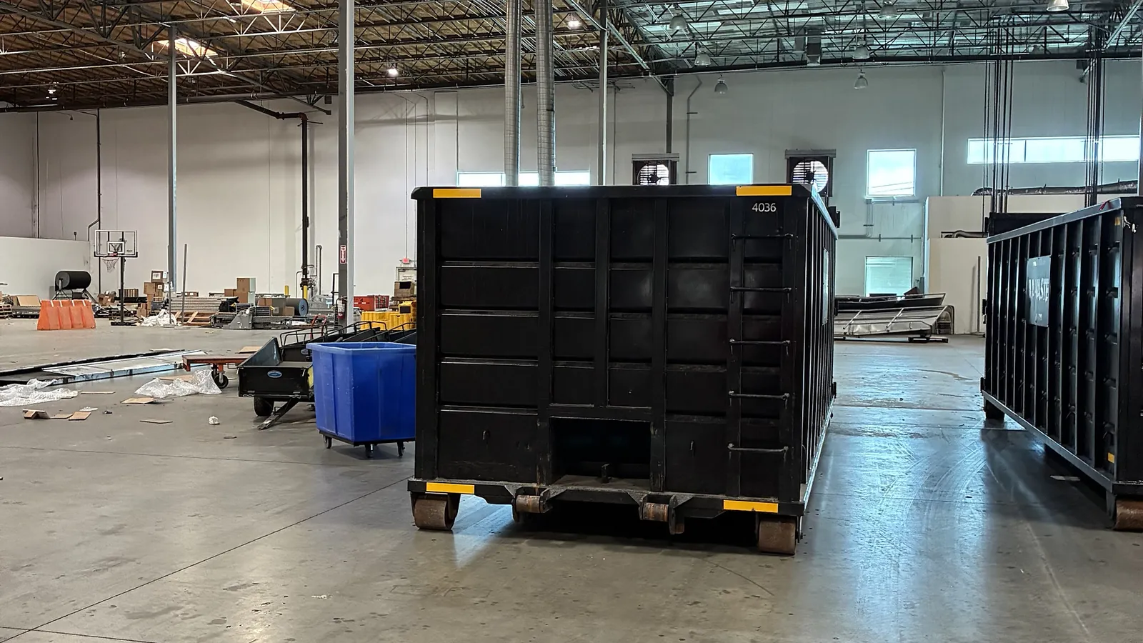 LA Waste 40 yard dumpster inside a warehouse cleanout